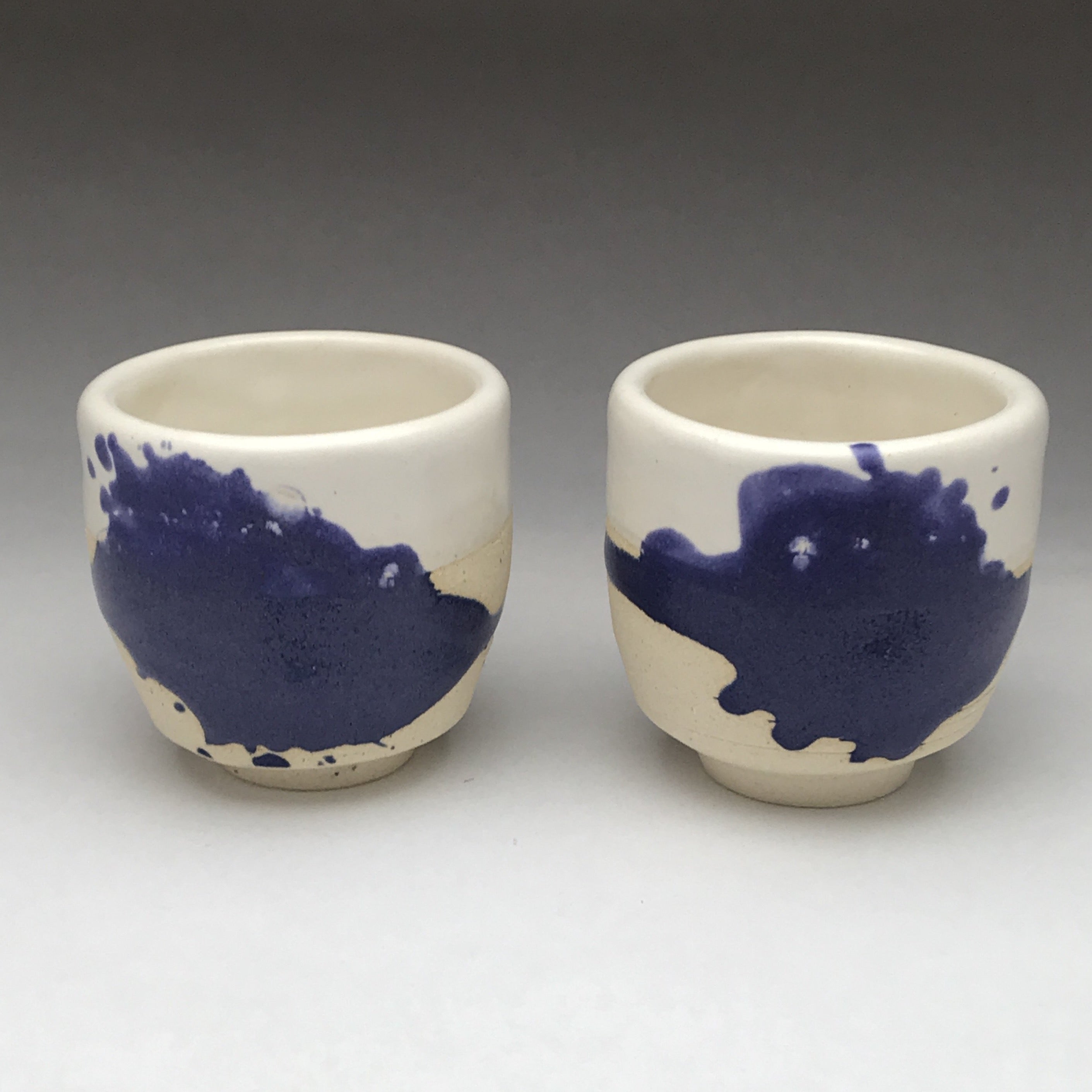 yunomi tea cup whiskey sipper with cobalt blue and white drippy design